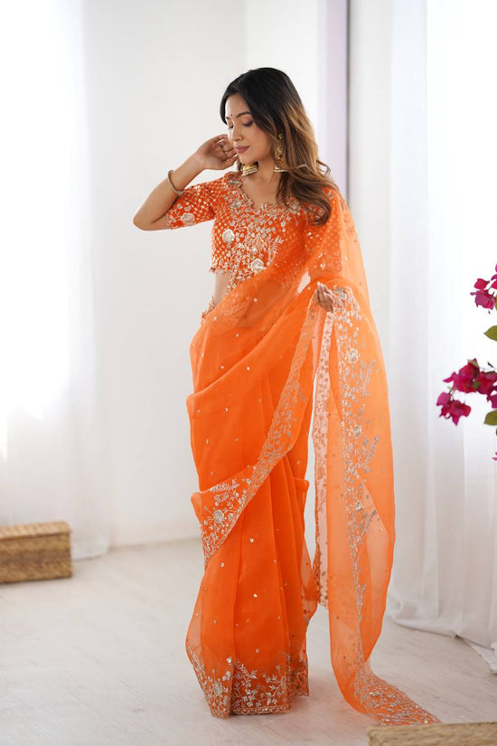 Festive Weeding Wear Orange Organza Saree with Silver Motifs