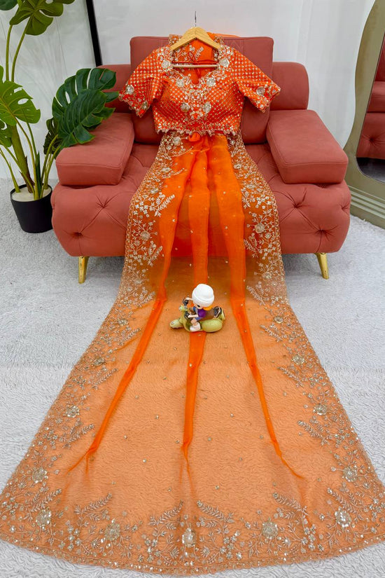 Festive Weeding Wear Orange Organza Saree with Silver Motifs