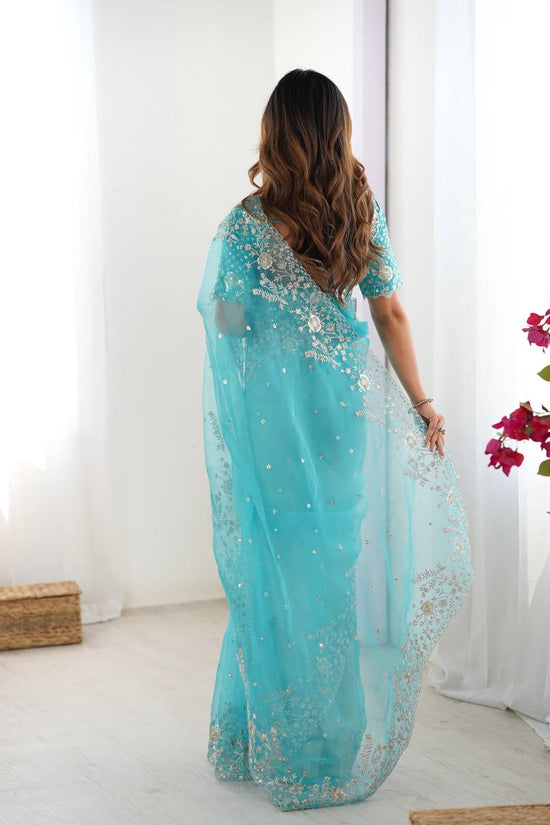 Festive Weeding Wear Orange Organza Saree with Silver Motifs