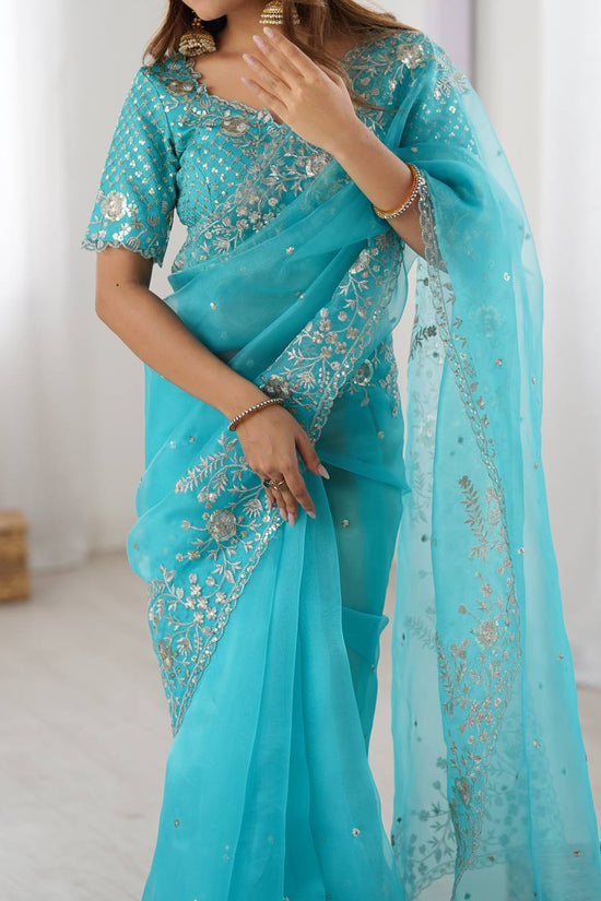 Festive Weeding Wear Orange Organza Saree with Silver Motifs