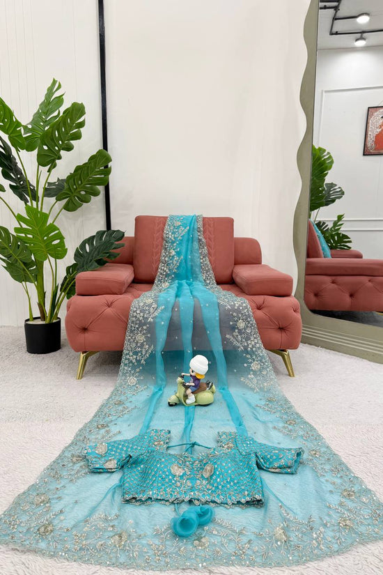 Festive Weeding Wear Orange Organza Saree with Silver Motifs