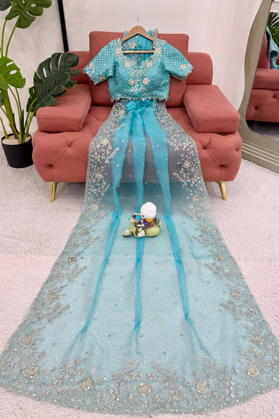 Festive Weeding Wear Orange Organza Saree with Silver Motifs