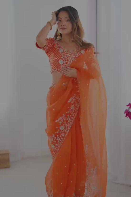 Festive Weeding Wear Orange Organza Saree with Silver Motifs