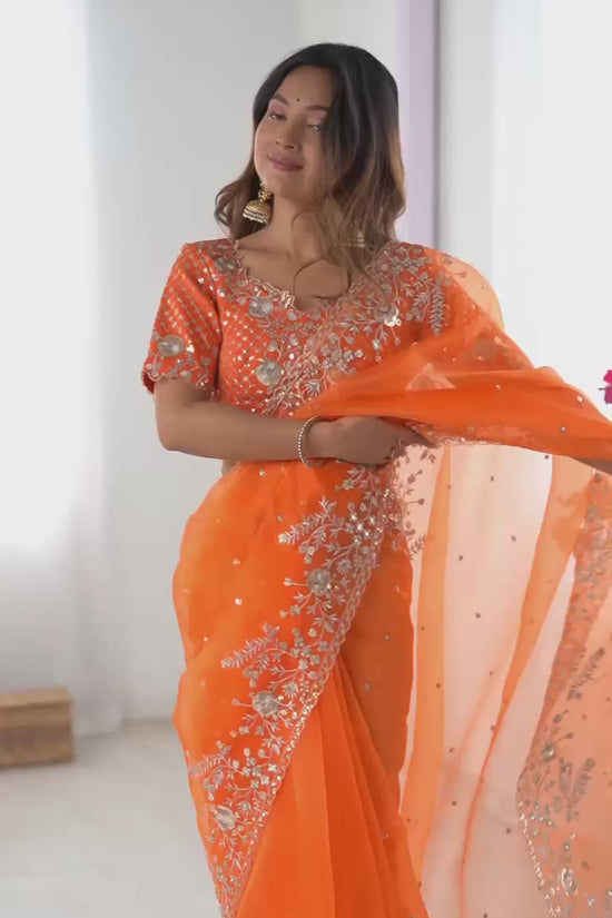 Festive Weeding Wear Orange Organza Saree with Silver Motifs